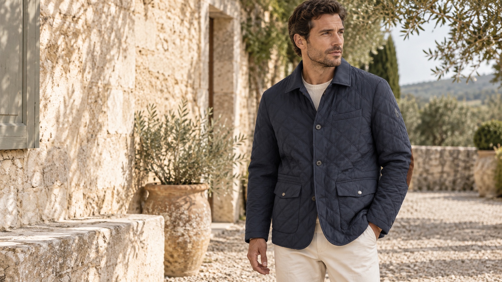 Editorial concept of the DAZY-B01 navy quilted jacket in a stone courtyard